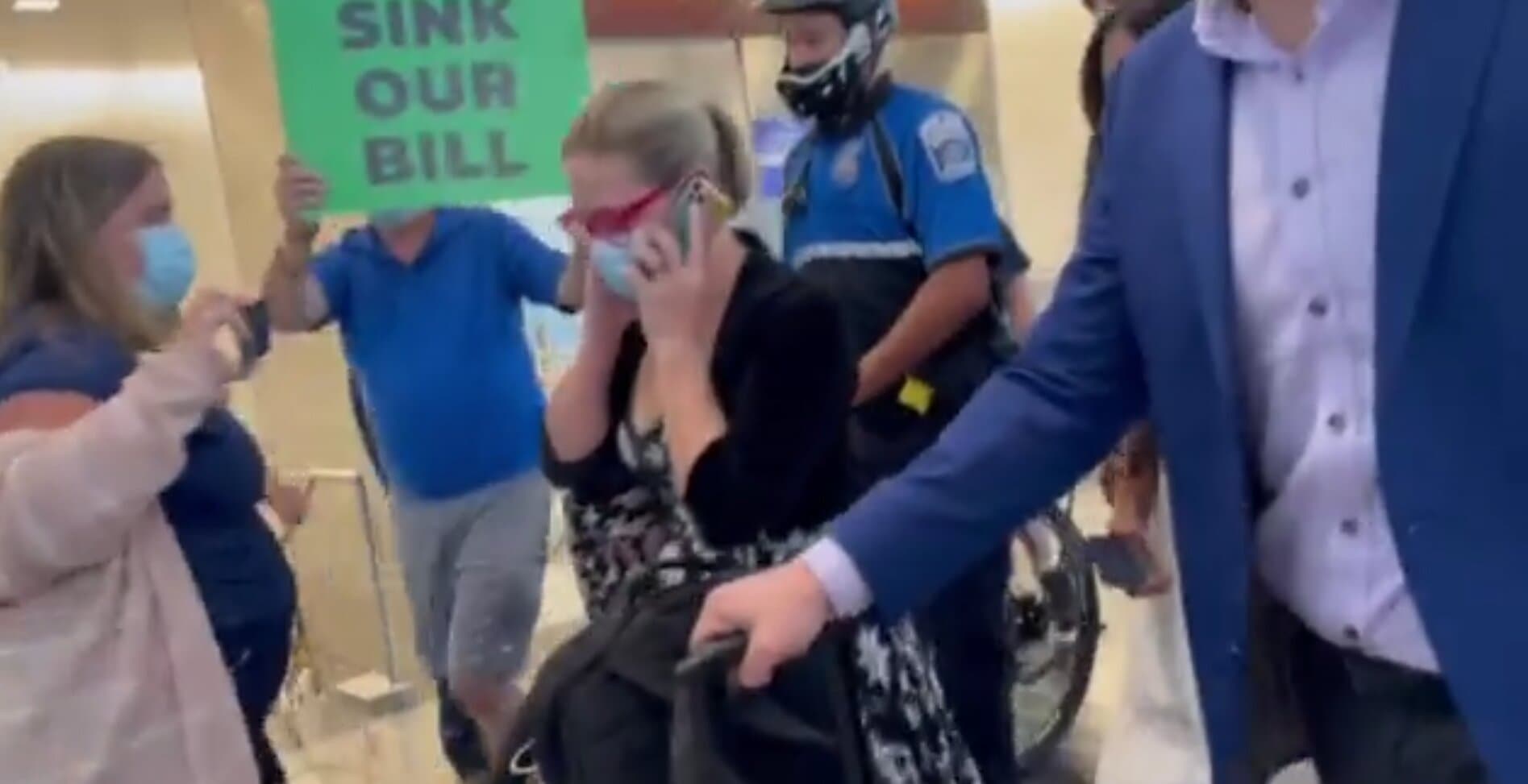 Sinema Confronted by Protesters at DC Airport Over Biden’s ‘Build Back Better’ Agenda