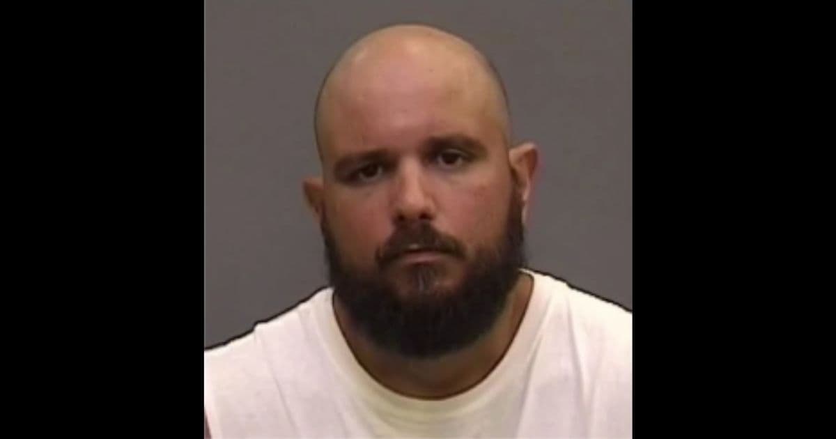 'Dad' Thrown in Handcuffs After Little Girl on a Bike Mouths 8 Words to Passing Woman
