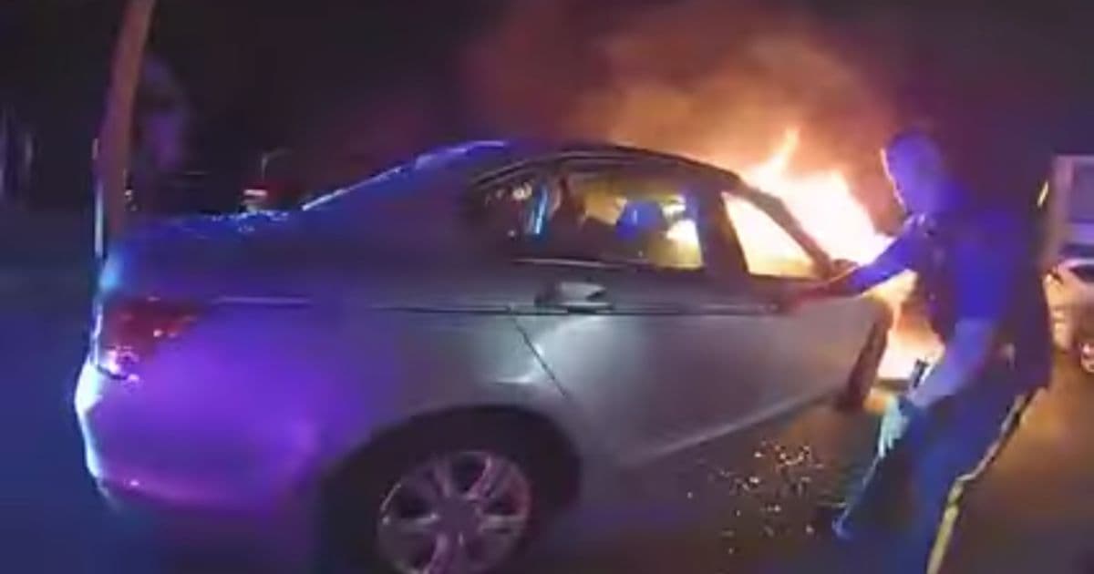 Man Panics as Car Catches on Fire After Electrical Failure, Trapping Him Inside Until Police Arrive