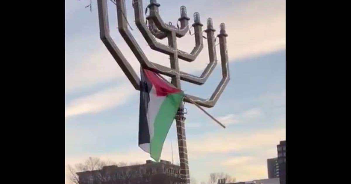 Watch: Yale Student Climbs Giant Menorah to Plant Palestinian Flag