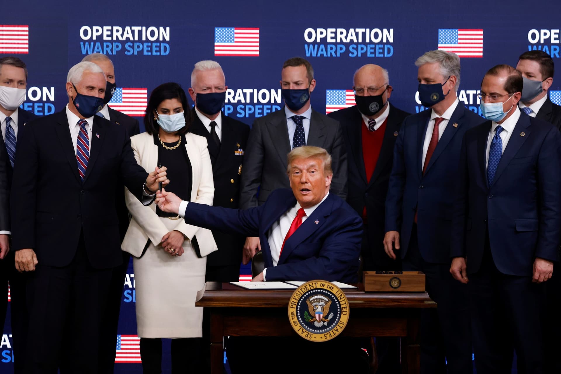 While Seeking Credit for Vaccine, Trump Says He May Invoke Defense Production Act