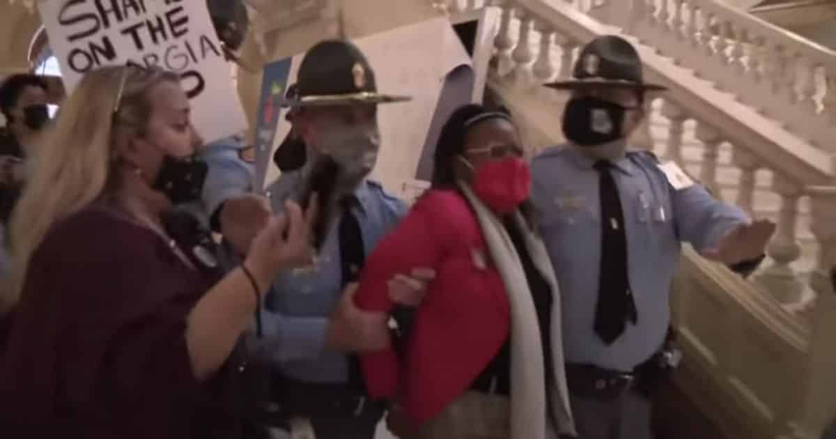 Georgia Dem Arrested After Repeatedly Defying Police And Hammering on Governor's Door During Protest
