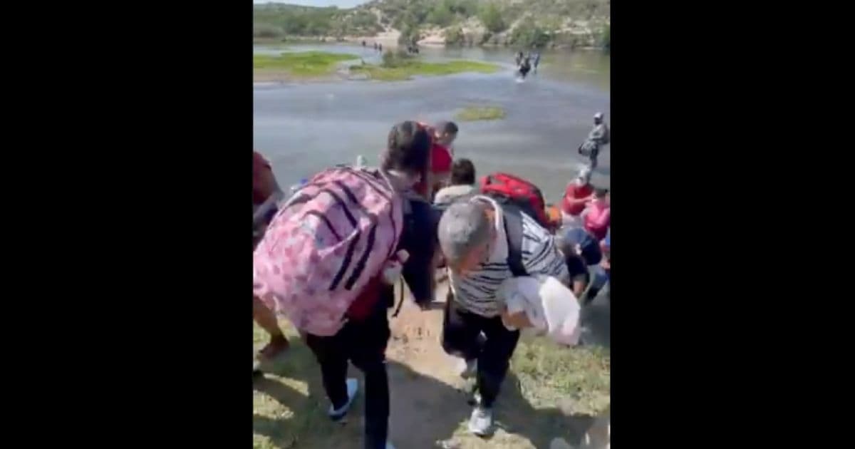 Video Reveals Hundreds of Illegal Immigrants Crossing River Into the US