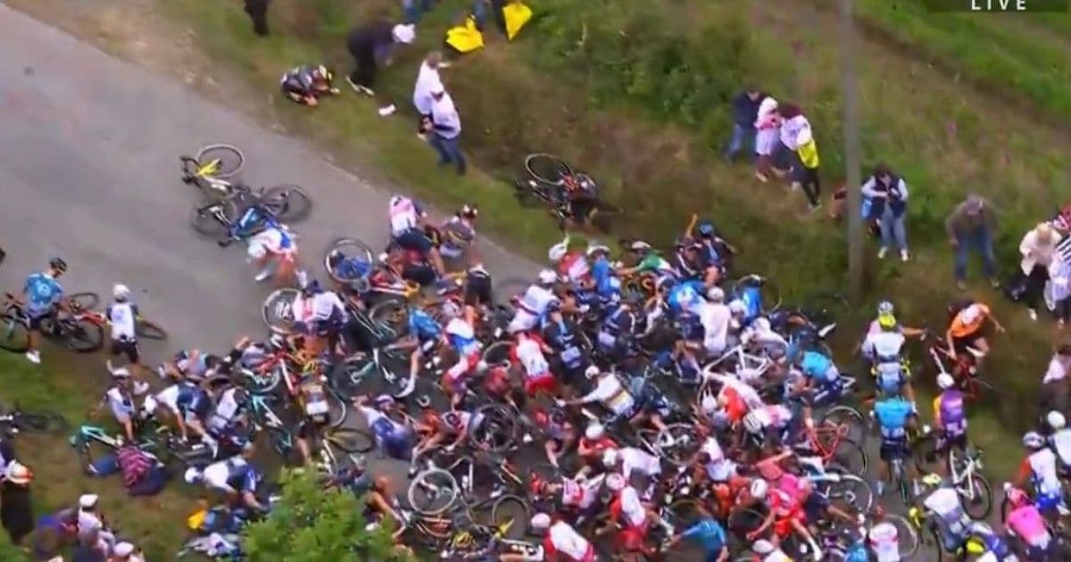 Fan Holding Sign Causes Massive Pileup at Tour de France