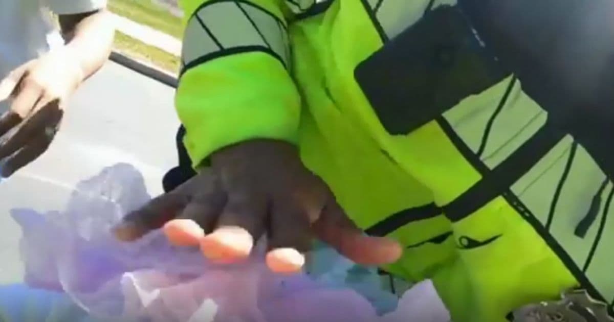 Video: Mom Spots Officers on the Road and Jumps Out of Car Screaming That Her Baby's Not Breathing