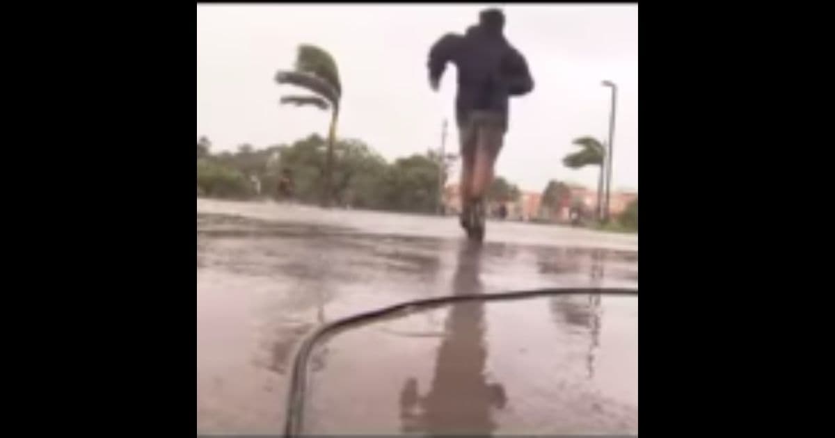 Cameraman Drops His Camera and Sprints to Help Family in Distress During Hurricane Ian Live Shot