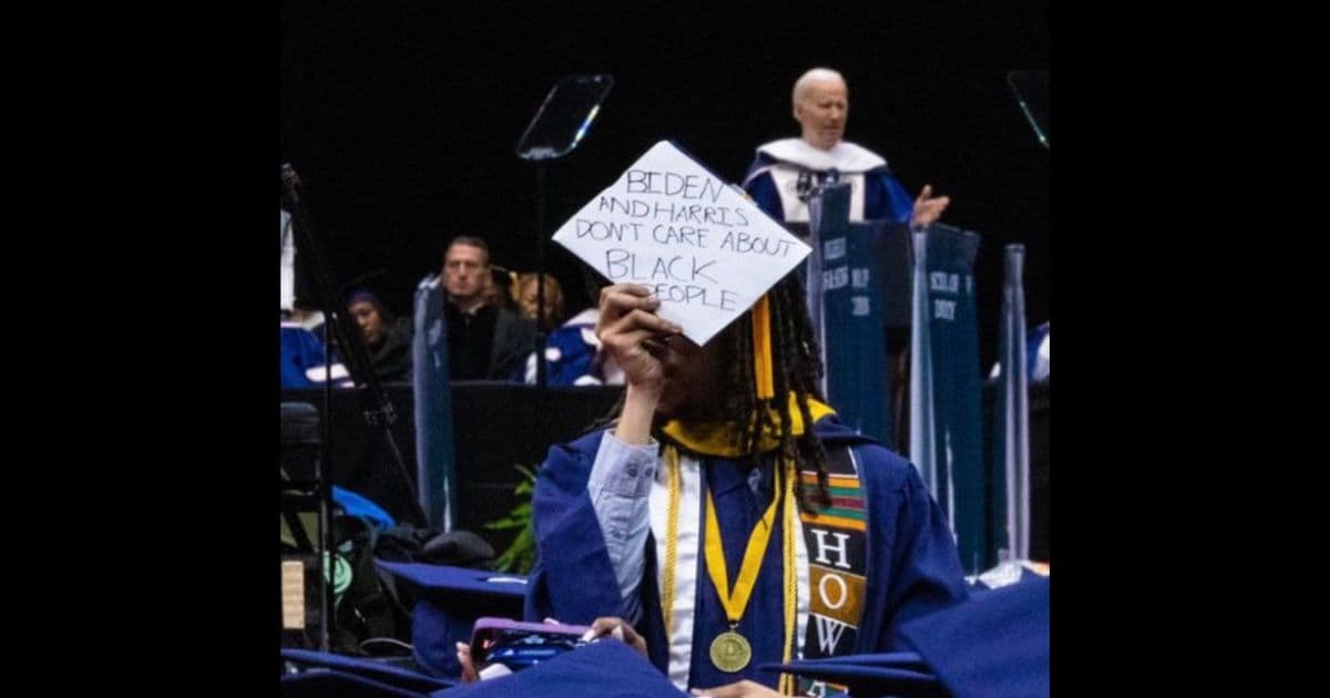 Black Graduate Stands Up During Biden’s Commencement Speech, Displays the Devastating Message Written on His Cap