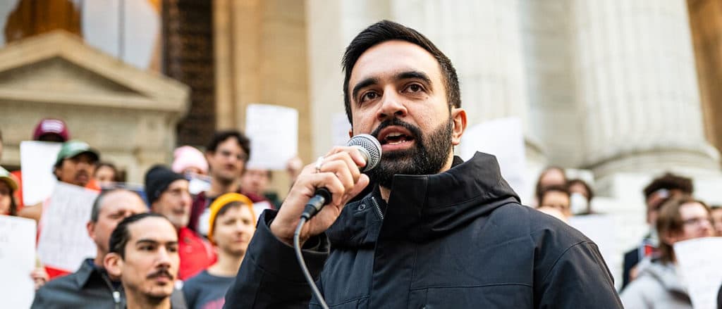 Socialist Mamdani Hits Campaign Trail At Terror-Linked Imam’s Mosque