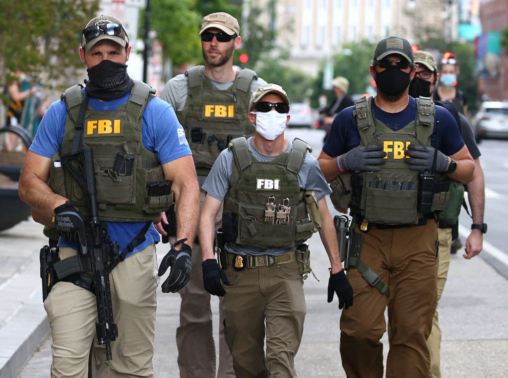 Fired FBI Agents Say Kneeling Was Tactical, Not Political, Sue to Get Jobs Back