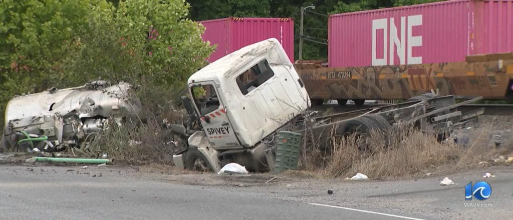 Septic Truck Explodes After Being Struck By Train, Video Shows