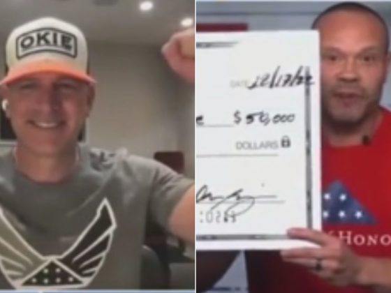 During a Fox News segment, Dan Bongino, right, donated $100,000 to the charity Fold of Honor, which honors military veterans and first responders, presenting first a check for $50,000 to CEO Lt. Col. Dan Rooney, left, before doubling the donation.