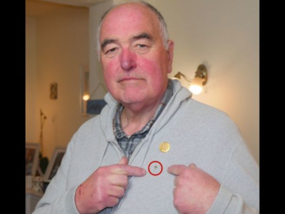 Derek Timms, a chaplain, was told he could not wear his cross pin.
