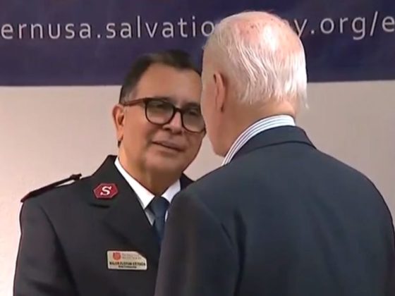 President Joe Biden greets a Salvation Army officer at a migrant services center in El Paso, Texas, on Sunday.