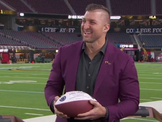 Tim Tebow's fellow on-air ESPN personalities surprised him before Monday's college football national championship game with the announcement that he had been accepted into the College Football Hall of Fame.