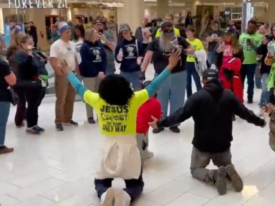 A group of demonstrators, many wearing "Jesus Is The Only Way" shirts, gathered at the Mall of America on Saturday to show support for preacher Paul Shoro.