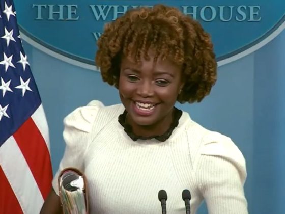White House press secretary Karine Jean-Pierre giggles during her news briefing Thursday.