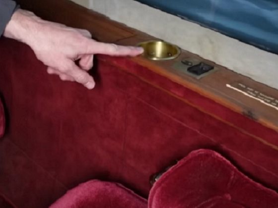 YouTube personality James Webb points to an ashtray on board a private jet once owned by superstar Elvis Presley.