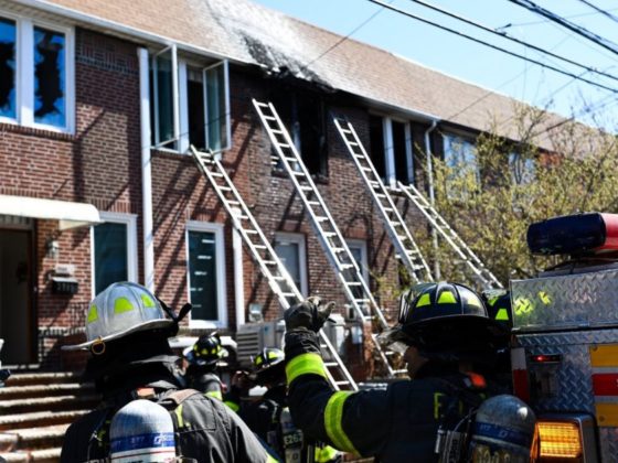 A 7-year-old boy and a 19-year-old girl were killed in the fire, which officials said blocked the front door.