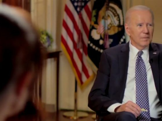President Joe Biden gestures to a staffer who was trying to interrupt during an interview broadcast Friday with MSNBC's Stephanie Ruhle.