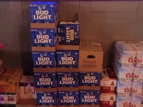 Cases of unsold Bud Light are stacked against a wall at a Houston restaurant.