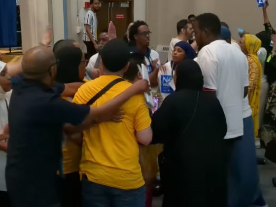 During the Minneapolis DFL Ward 10 meeting scheduled to chose a city council nominee, Council Member Aisha Chughtai and her supporters took the stage for her speech, then Nasri Warsame supporters advanced towards the stage, and began pushing and shoving.