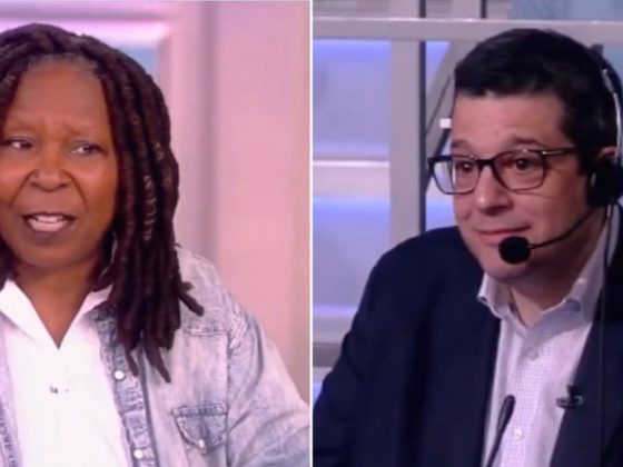 "The View" co-host Whoopi Goldberg, left, asks "The View" executive producer Brian Teta what the next topic is for the show.