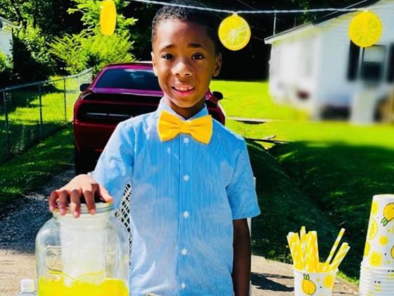 Cam Johnson poses with his lemonade stand.