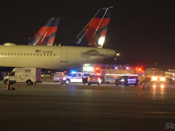 Emergency vehicles surround the Delta Airlines jet where a ground crew worker was killed Friday night in San Antonio, Texas.