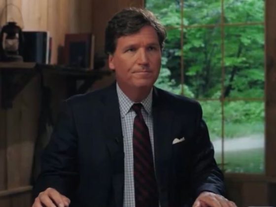 Tucker Carlson is seen at his news desk for his new show “Tucker on Twitter” in a Tuesday episode.