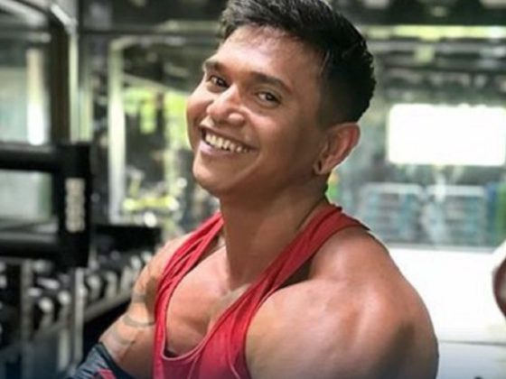Bodybuilding influencer Justyn Vicky smiles in an Instagram photo.