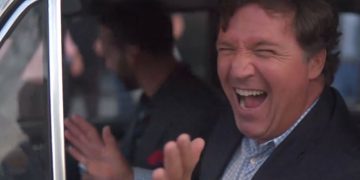 Former Fox News host Tucker Carlson "geeked out" over the old Russian car during the interview.