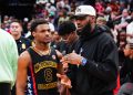 Lebron James Slammed for Sitting Down During National Anthem at Son’s Game