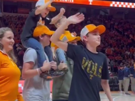 On Dec. 9, the family of Lieutenant Commander Zachary Smith attended a Tennessee Volunteers basketball game in Knoxville, Tennessee, and took the court during a commercial break to hear a special message from the deployed husband and father, but then they got a special surprise.