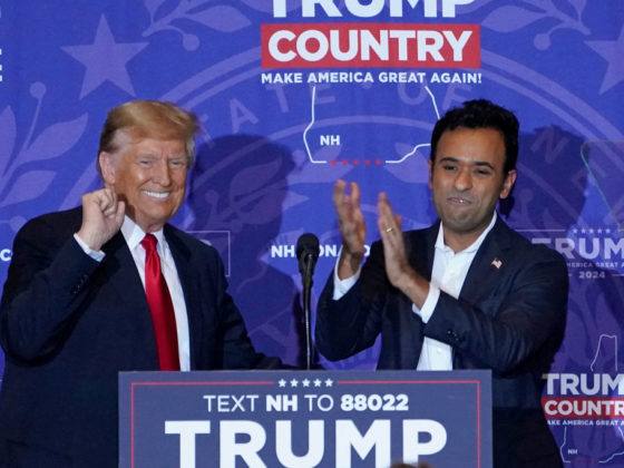 TOPSHOT - US entrepreneur Vivek Ramaswamy (R) endorses Republican presidential candidate former US President Donald Trump during a campaign event at the Atkinson Resort and Country Club in Atkinson, New Hampshire, on January 16, 2024. Donald Trump steamrolled toward New Hampshire January 16, 2024 after his crushing win in Iowa cemented him as the likely Republican presidential nominee -- stopping on the way for a defamation trial that underscores how the road to November's election remains in uncharte d territory. Ramaswamy dropped out and endorsed Trump on January 15, 2024 night.