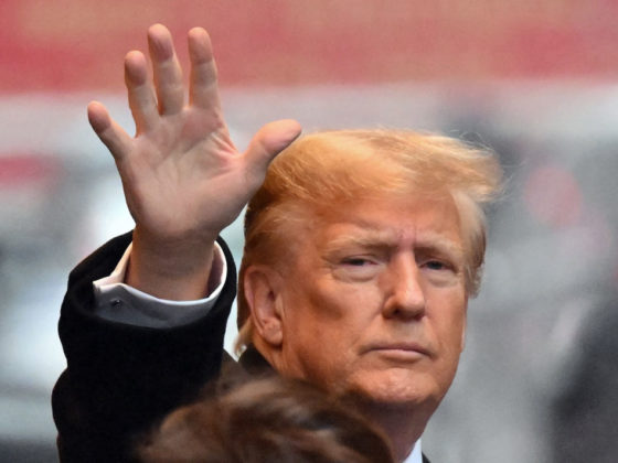 Former US President Donald Trump waves as he departs for his sexual assault defamation trial in New York on January 25, 2024. Trump's trial resumes on Thursday, two days after the Republican primaries in New Hampshire, with the former US president expected to testify. Writer Jean Carroll, 80, is seeking more than $10 million alleging that Trump defamed her when he mocked her sexual assault accusations by saying she "is not my type." (Photo by ANGELA WEISS / AFP) (Photo by ANGELA WEISS/AFP via Getty Images)