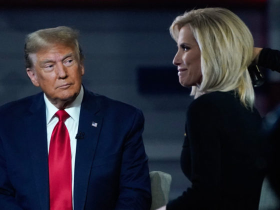 (L-R) Former US President and 2024 Republican presidential hopeful Donald Trump sits onstage with host Laura Ingraham during a break in a Fox News Town Hall event at the Greenville Convention Center in Greenville, South Carolina, on February 20, 2024. (Photo by TIMOTHY A. CLARY / AFP) (Photo by TIMOTHY A. CLARY/AFP via Getty Images)