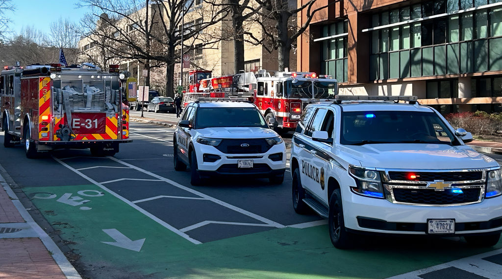 US Secret Service vehicles block access to a street leading to the Embassy of Israel in Washington, DC on February 25, 2024. A man reportedly set himself on fire near the embassy on Sunday afternoon. (Photo by Mandel NGAN / AFP) (Photo by MANDEL NGAN/AFP via Getty Images)