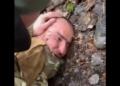 Russian prisoner Saidakrami Rachabalizoda, a suspect in the March 22 terrorist attack, is beaten by soldiers.