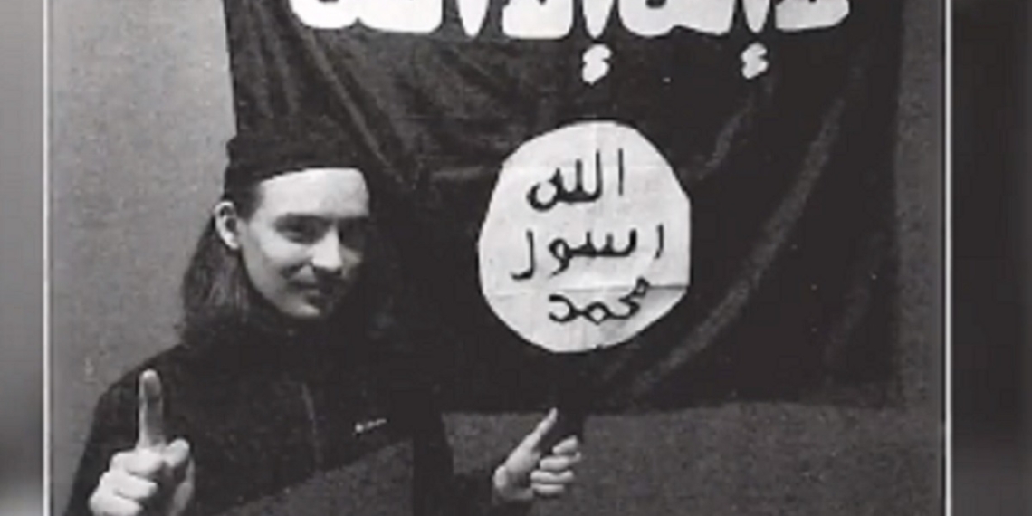 Alexander Scott Mercurio, 18, is pictured before a flag of the Islamic State group in a still from a CNN news cast about his arrest.