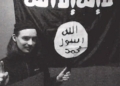Alexander Scott Mercurio, 18, is pictured before a flag of the Islamic State group in a still from a CNN news cast about his arrest.
