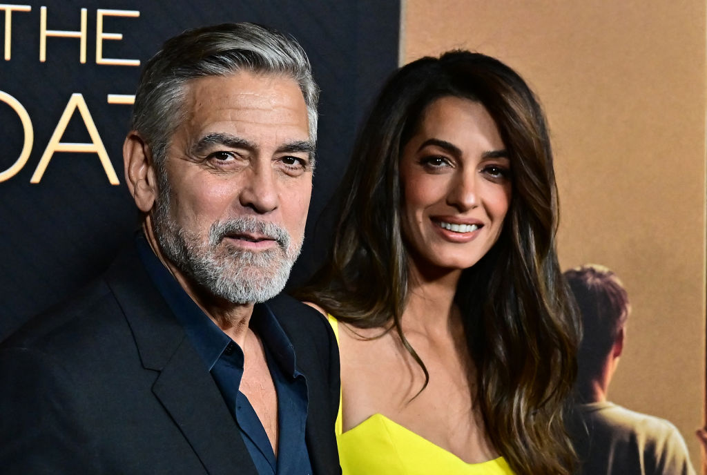 Clooney Defends Wife With Call to Biden Aide