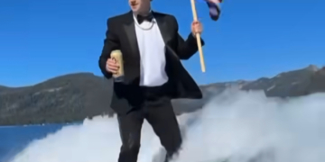 Zuckerberg Wakesurfs in Tuxedo While Holding Flag, Drinking Beer — Sparks Reaction