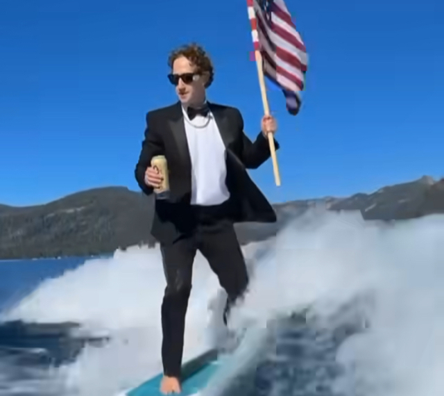 Zuckerberg Wakesurfs in Tuxedo While Holding Flag, Drinking Beer — Sparks Reaction