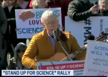 At Anti-Trump Rally, Former NIH Director Sings The Same Way He Practices Science