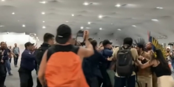 Feather-Headed Protesters Storm Elite Climate Summit In Chaotic Scene