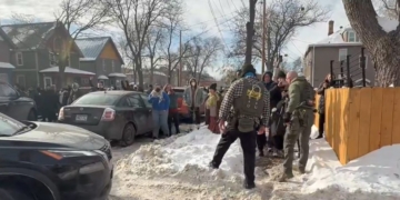 Crowd Surrounds ICE Agents During Enforcement Operation In Minneapolis