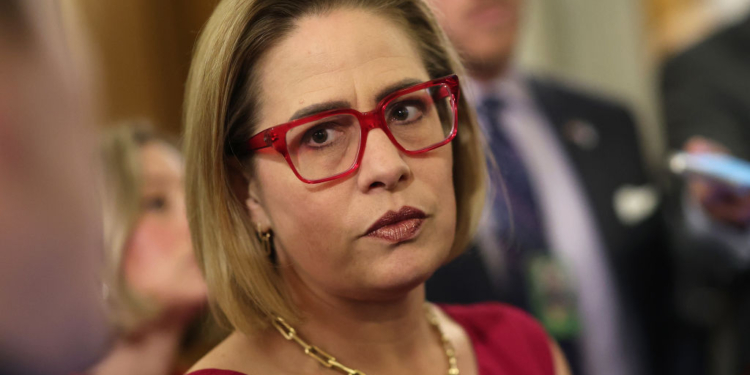 Men Shout Affair Claims at Kyrsten Sinema Panel as Ex-Bodyguard’s Wife Alleges Romance
