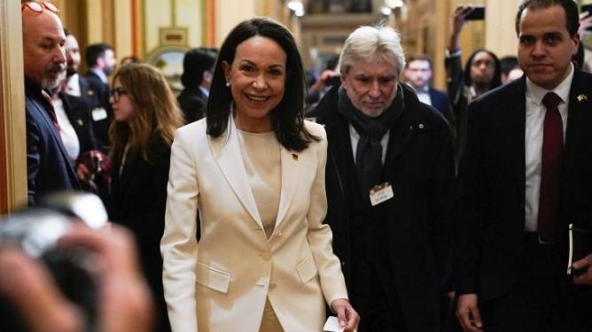 Maria Cornia Machado Gives Trump Gift During White House Visit