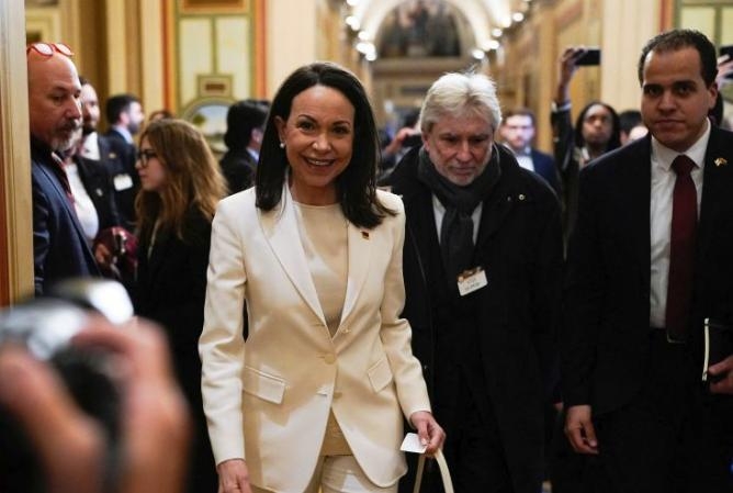 Maria Cornia Machado Gives Trump Gift During White House Visit