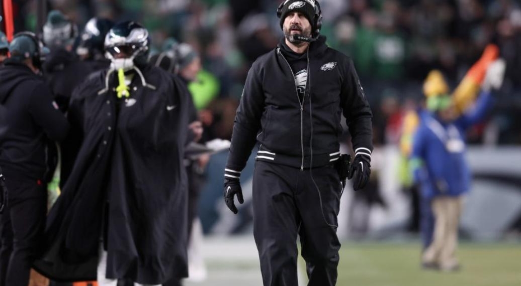 NFL Coach Restrained By Security After Exchange With Player